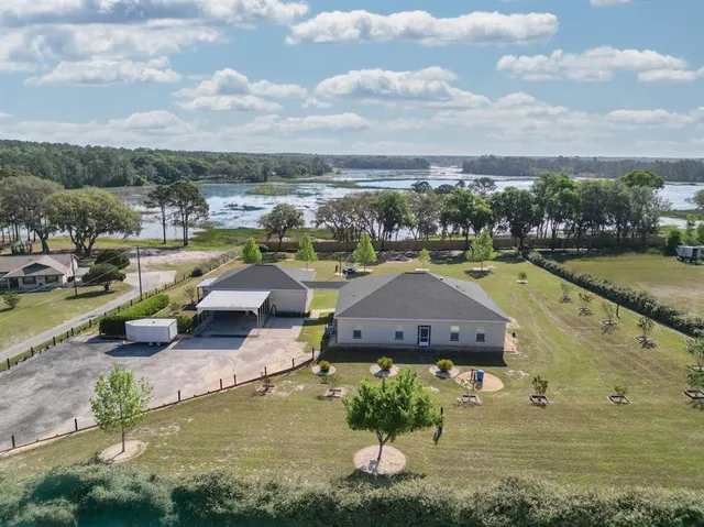 a view of a lake with couches and city view