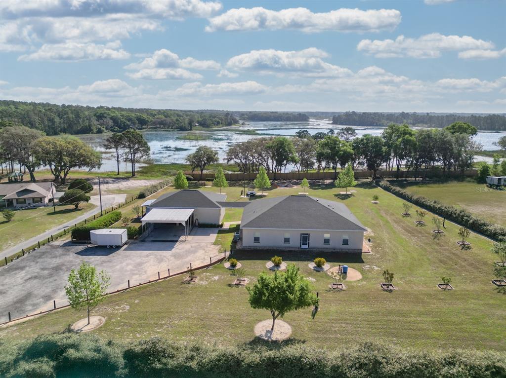 a view of a lake with couches and city view