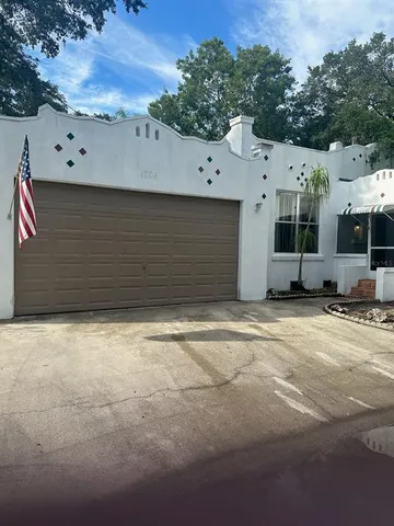 a living room with patio furniture and a window