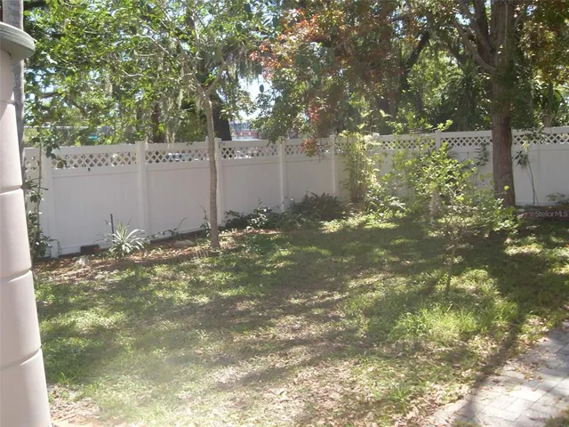 a room with water heater and a wooden floor