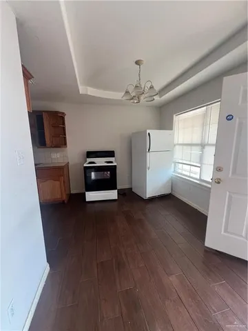 a view of a livingroom with furniture and a flat screen tv