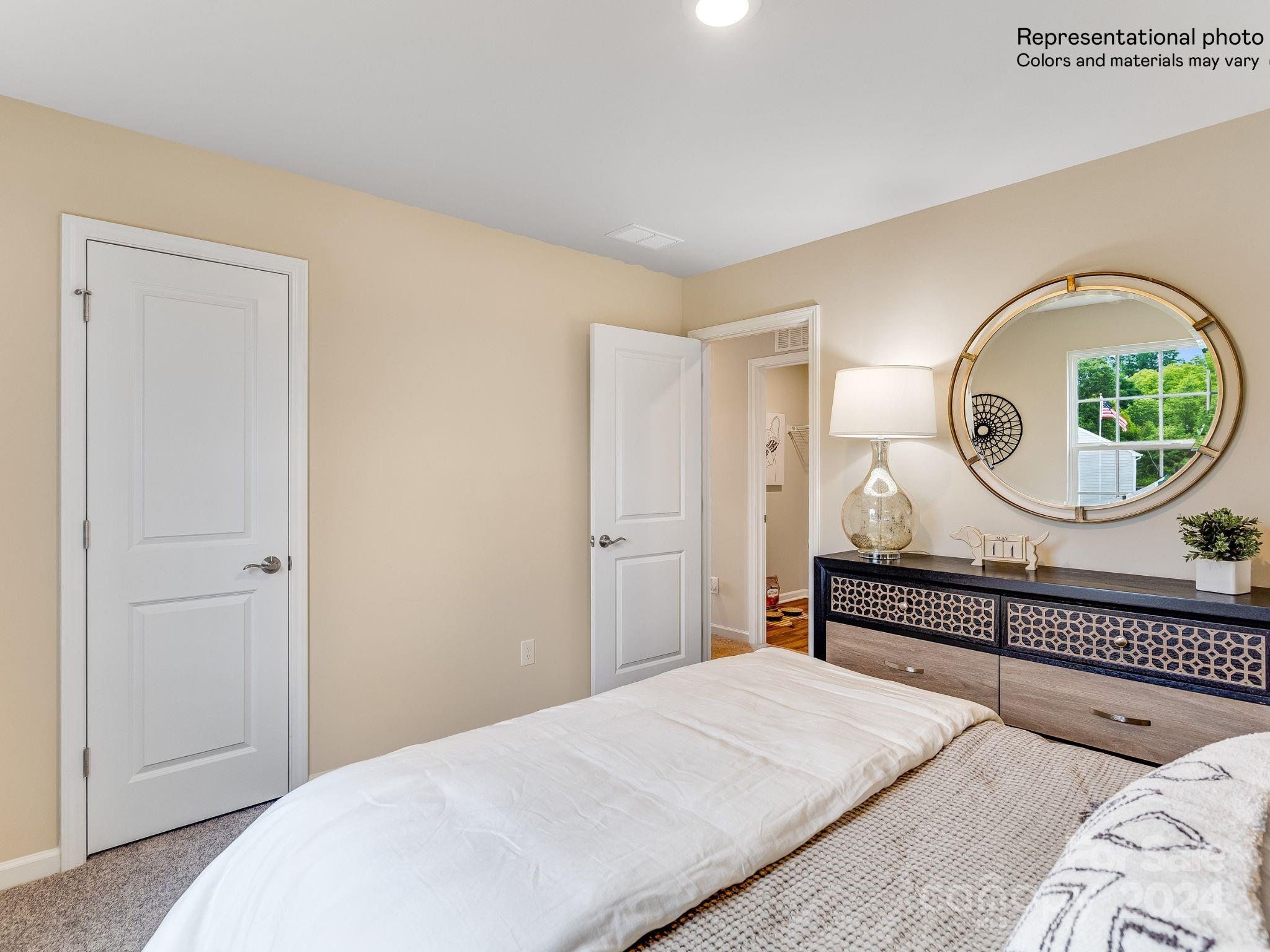 15126 Windy Plns Road Charlotte, NC 28262 - Photo 17 of 23 a bedroom with bed and a wooden floor
