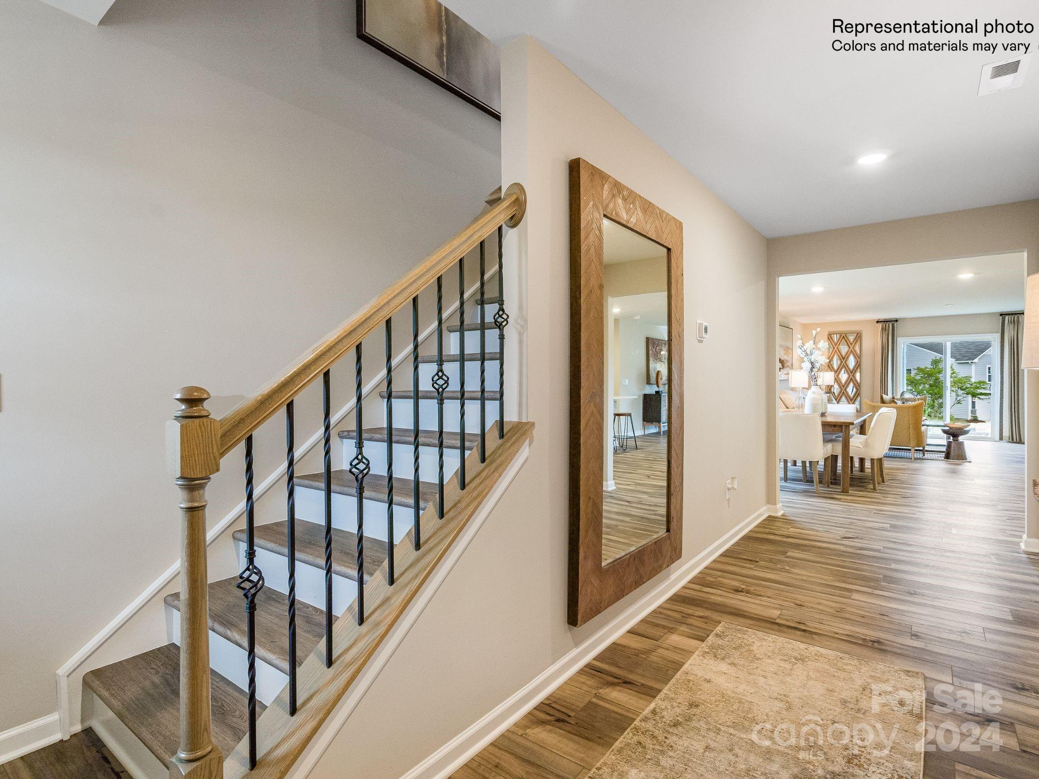 15126 Windy Plns Road Charlotte, NC 28262 - Photo 2 of 23 a view of an entryway wooden floor and livingroom