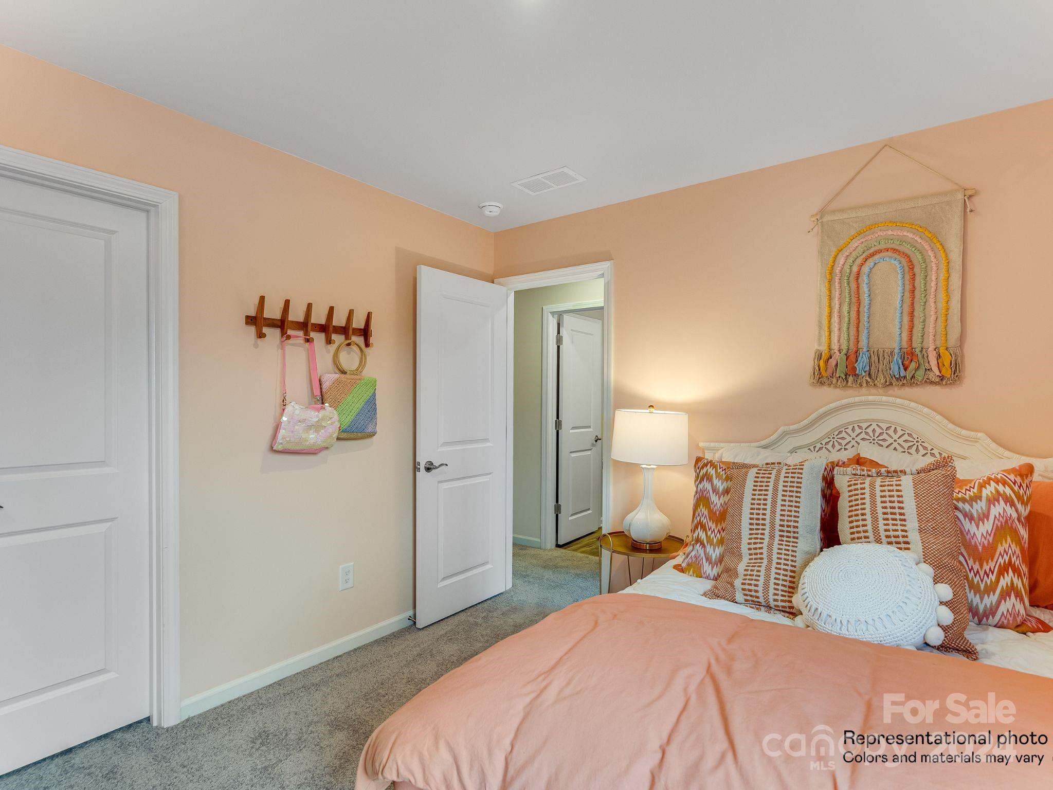 15126 Windy Plns Road Charlotte, NC 28262 - Photo 21 of 23 a bedroom with a bed and a couch