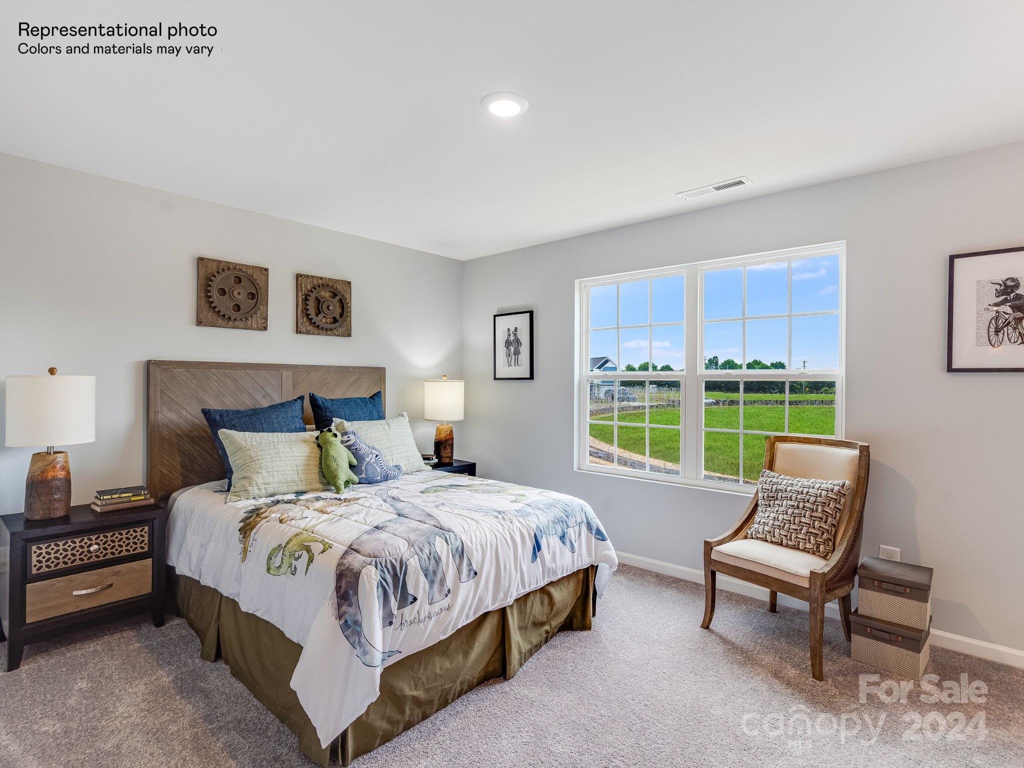 15126 Windy Plns Road Charlotte, NC 28262 - Photo 22 of 23 a bedroom with a bed and a couch
