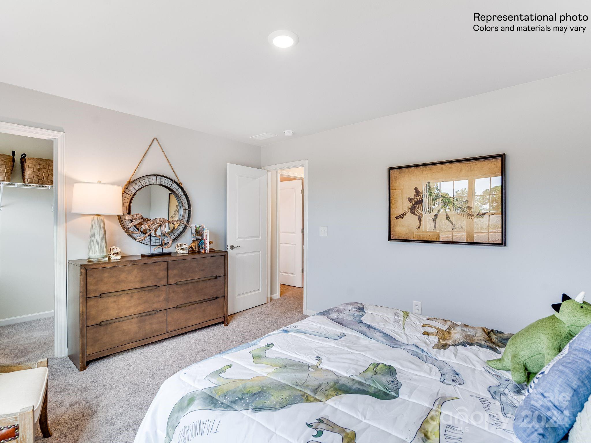 15126 Windy Plns Road Charlotte, NC 28262 - Photo 23 of 23 a bedroom with a bed and a dresser