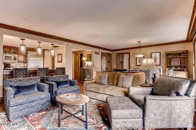 a living room with furniture and a table