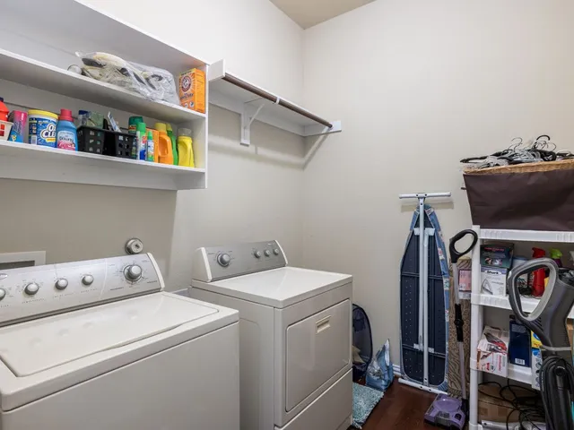 a view of storage and utility room with washer and dryer