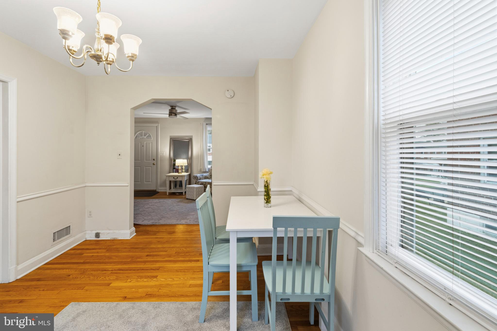166 Cherrydell Road Baltimore, MD 21228 - Photo 12 of 24 a view of a dining room with furniture and a chandelier