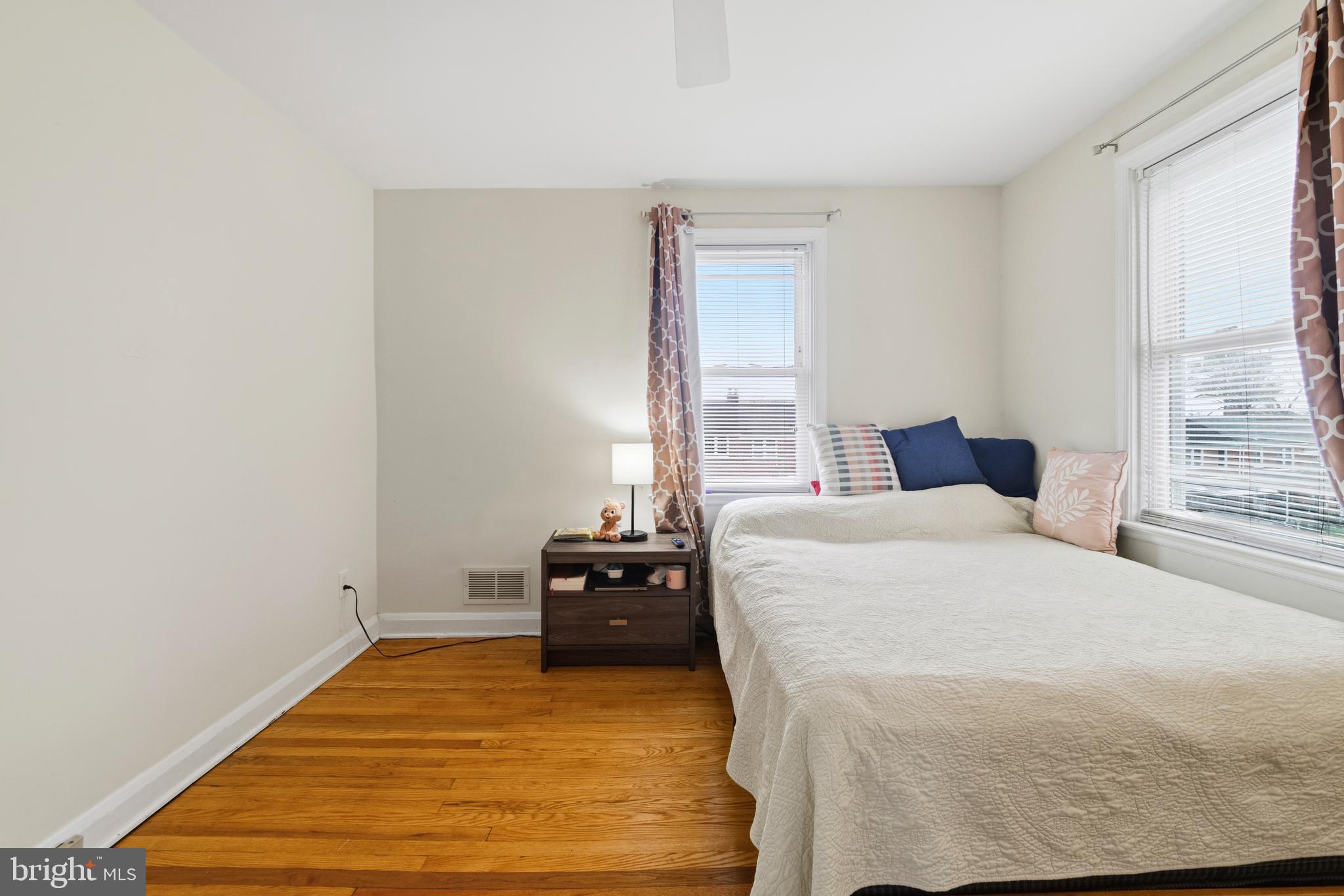 166 Cherrydell Road Baltimore, MD 21228 - Photo 18 of 24 a bedroom with a bed and a window