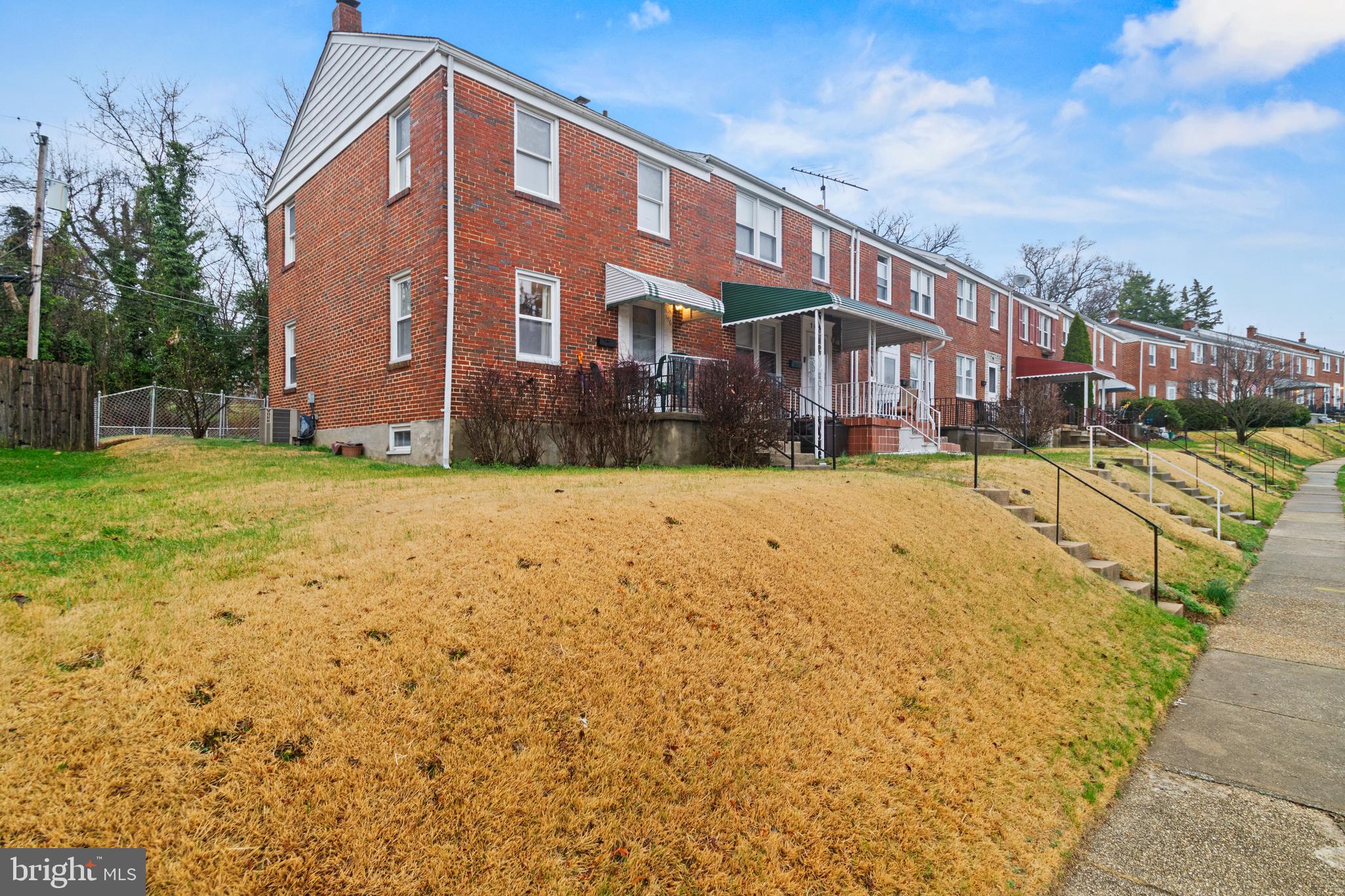 166 Cherrydell Road Baltimore, MD 21228 - Photo 2 of 24 a view of a building with a yard
