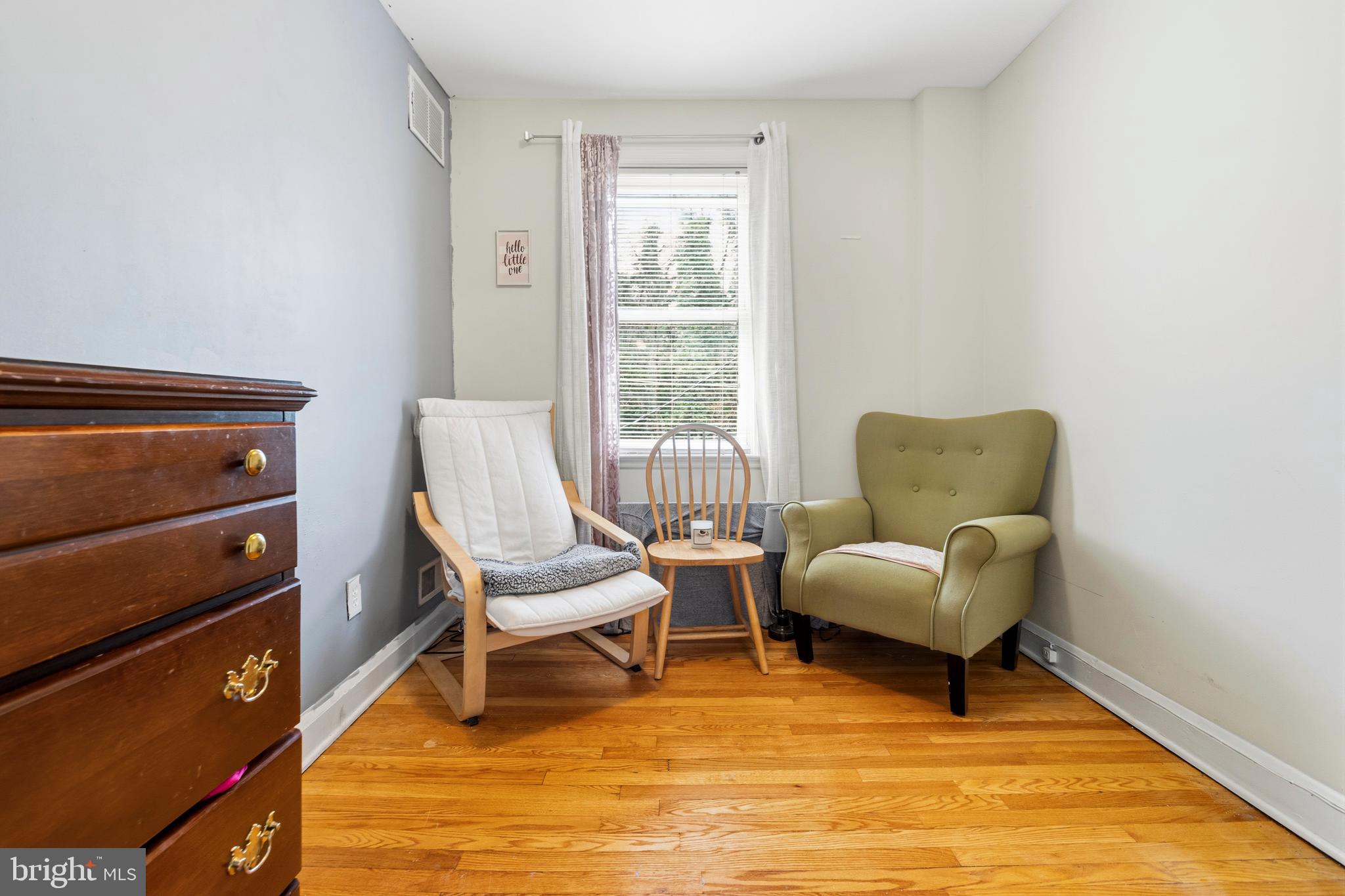166 Cherrydell Road Baltimore, MD 21228 - Photo 22 of 24 a living room with furniture and a window