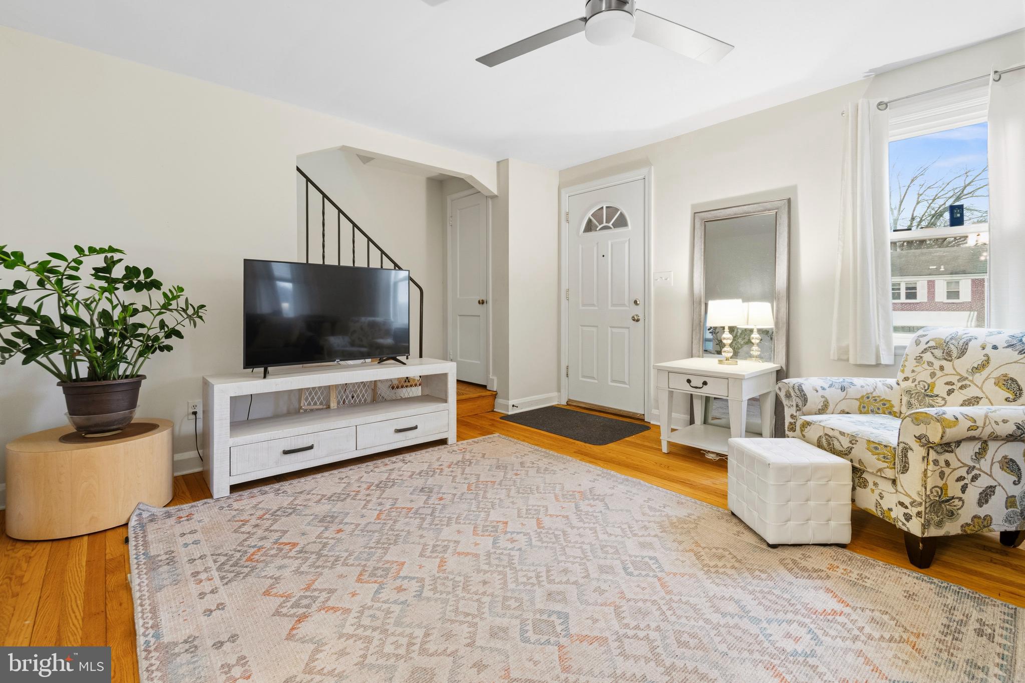 166 Cherrydell Road Baltimore, MD 21228 - Photo 6 of 24 a living room with furniture and a flat screen tv