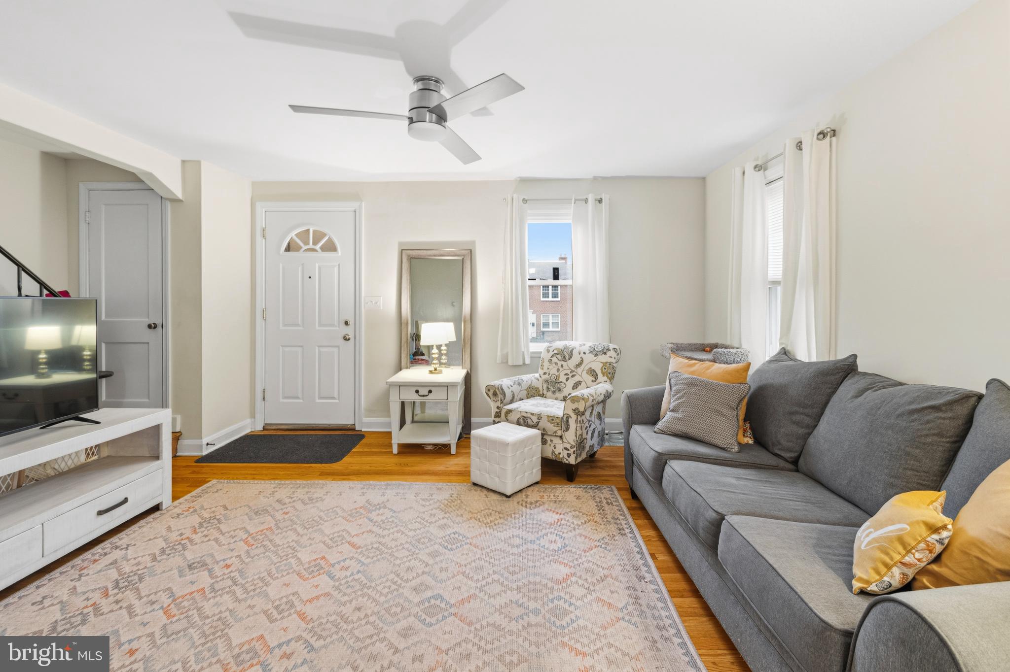 166 Cherrydell Road Baltimore, MD 21228 - Photo 7 of 24 a living room with furniture and a flat screen tv