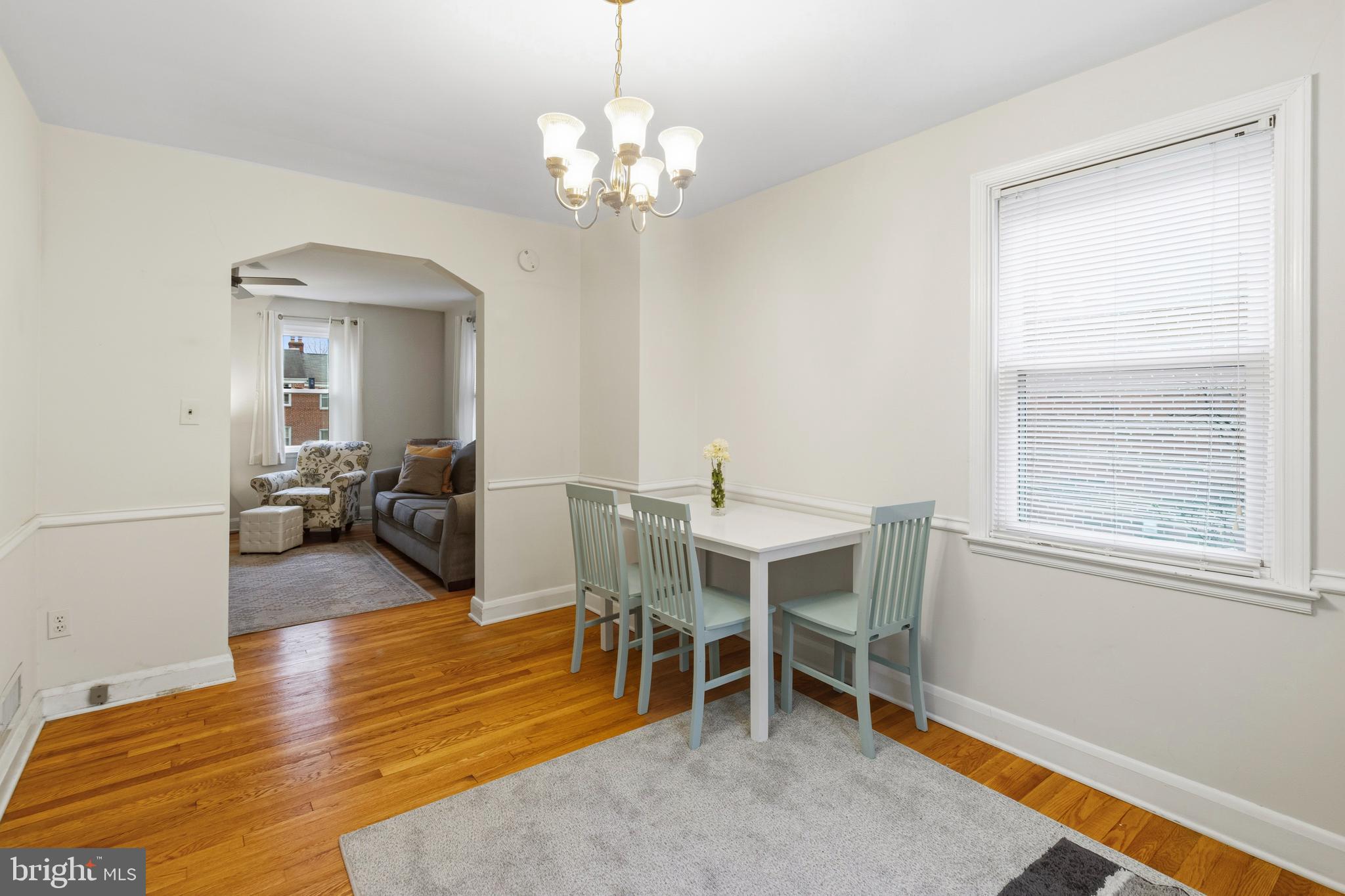 166 Cherrydell Road Baltimore, MD 21228 - Photo 9 of 24 a view of a livingroom with furniture and a chandelier