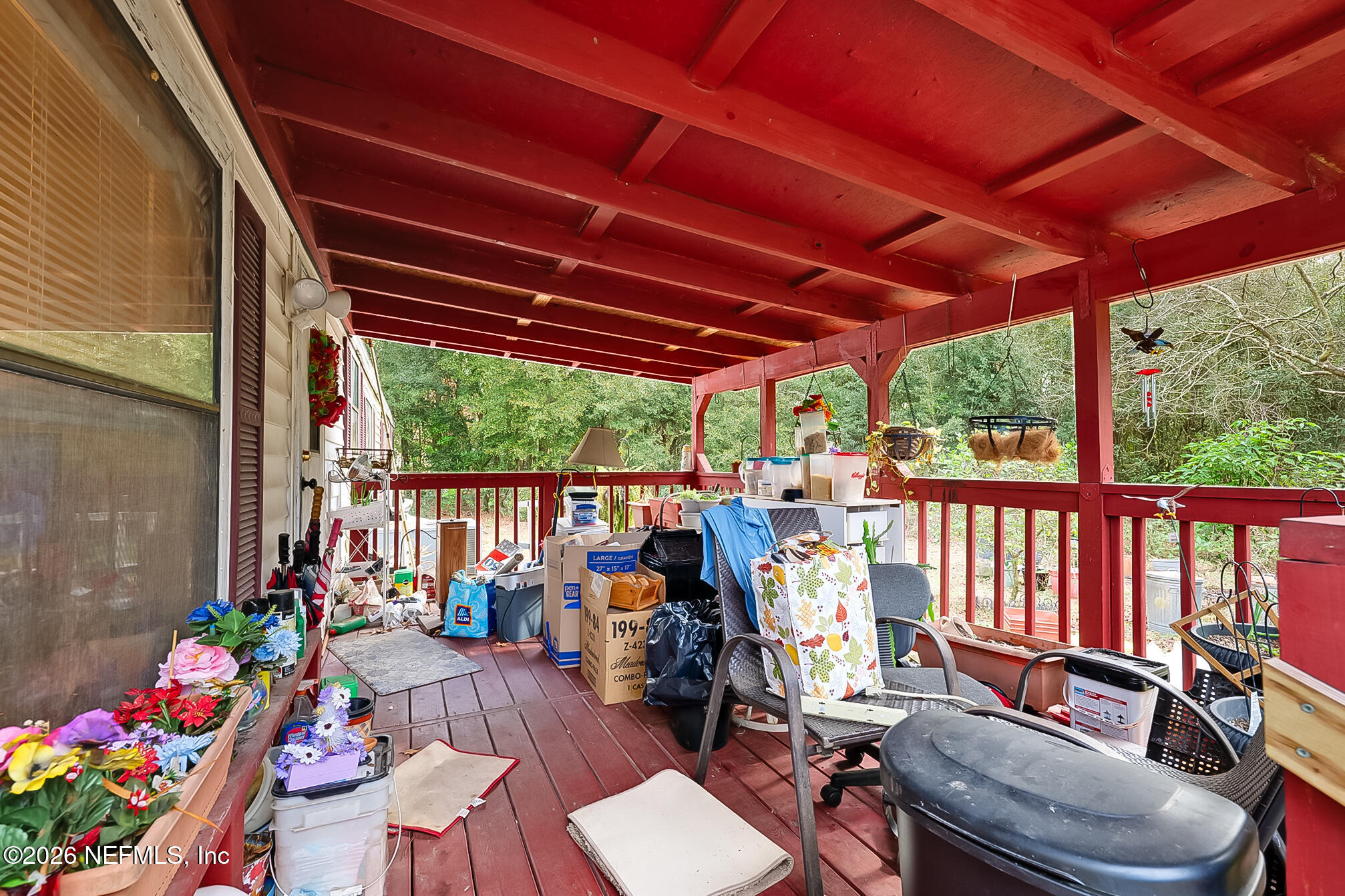 85110 Theresa Road Yulee, FL 32097 - Photo 21 of 24 a view of porch with furniture and garden view