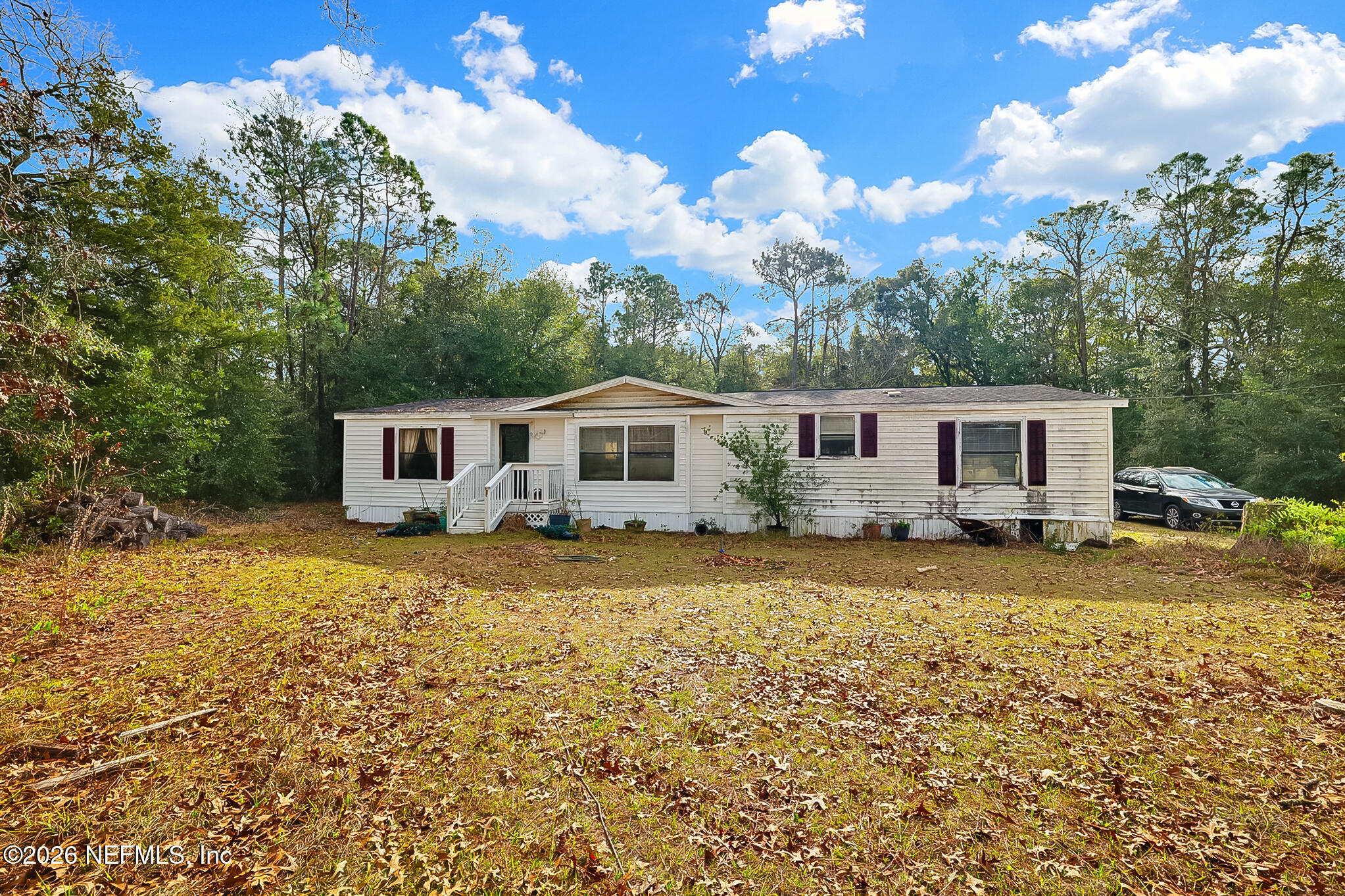 85110 Theresa Road Yulee, FL 32097 - Photo 24 of 24 a front view of a house with yard