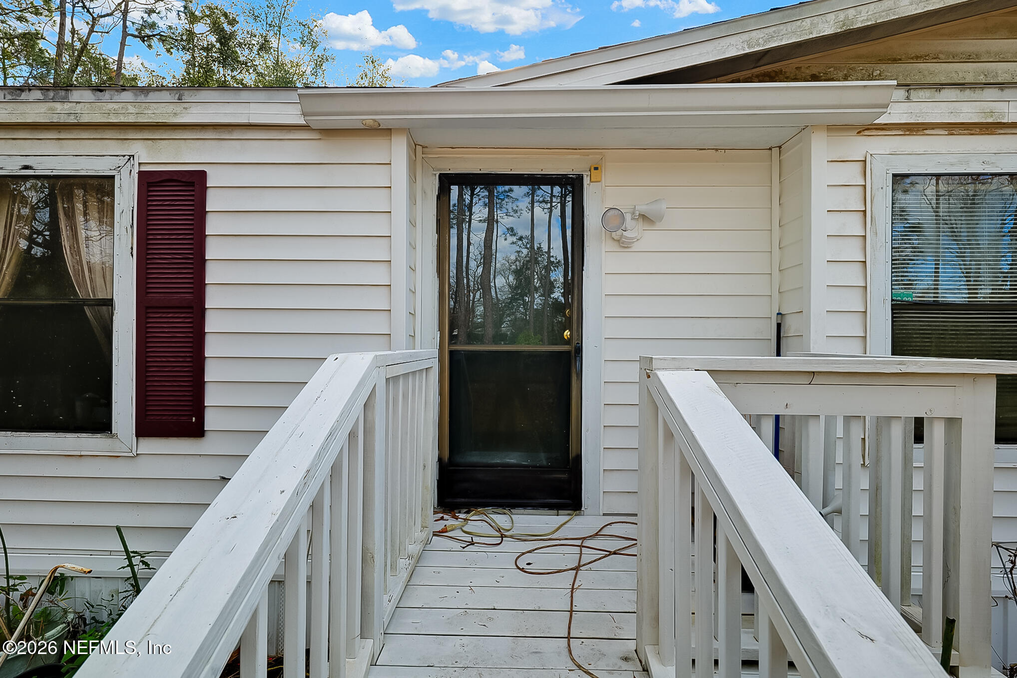 85110 Theresa Road Yulee, FL 32097 - Photo 5 of 24 a balcony with view of wooden balcony