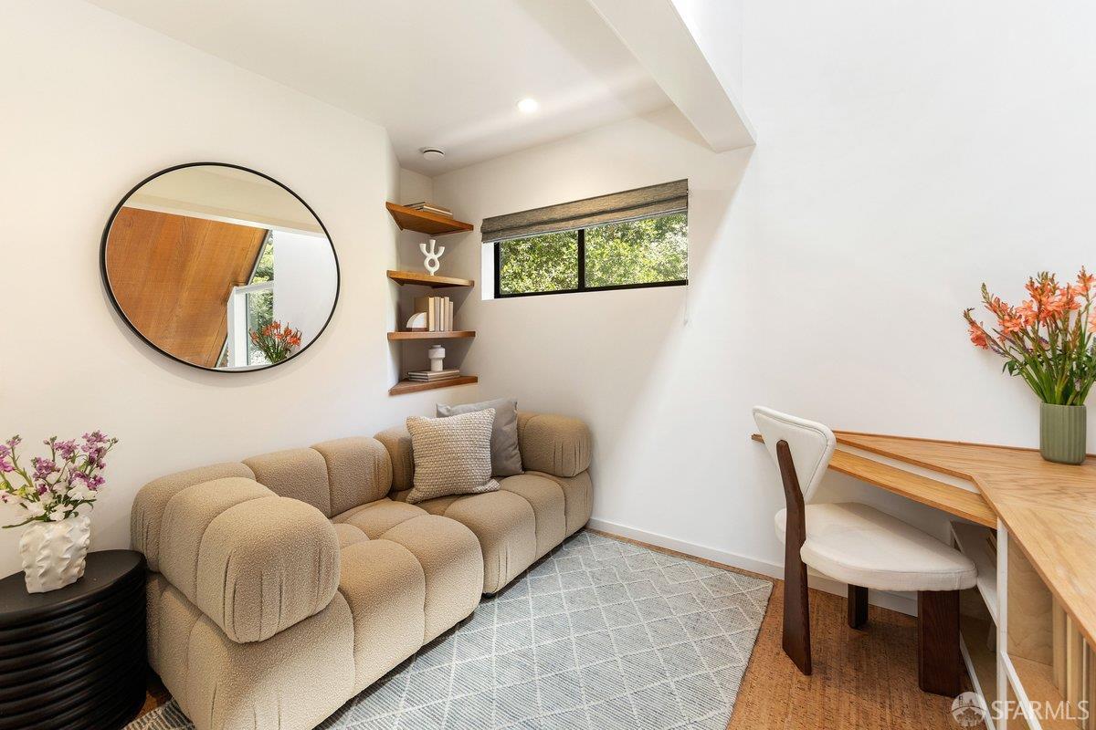 1824 Gouldin Road Oakland, CA 94611 - Photo 24 of 42 a living room with furniture a mirror and a potted plant