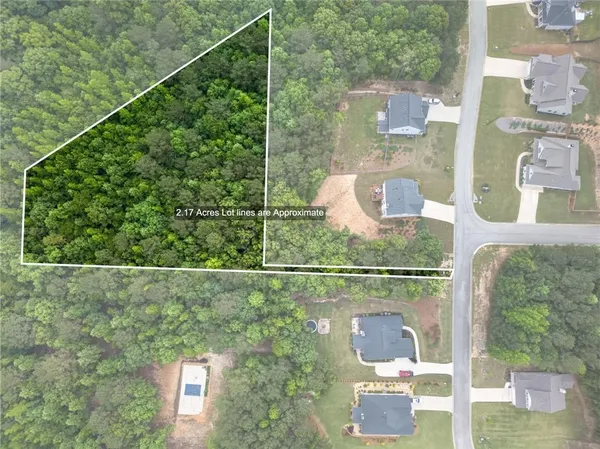 an aerial view of a house with outdoor space