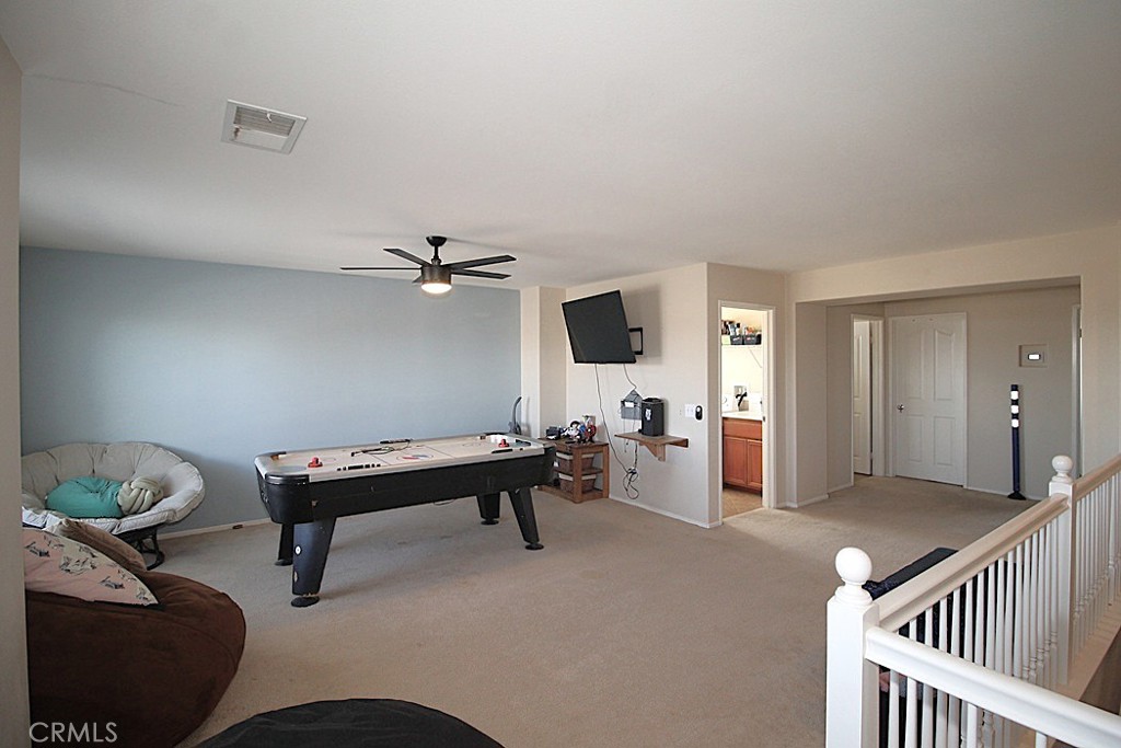 924 Condor Street Barstow, CA 92311 - Photo 23 of 52 a bedroom with furniture and a window