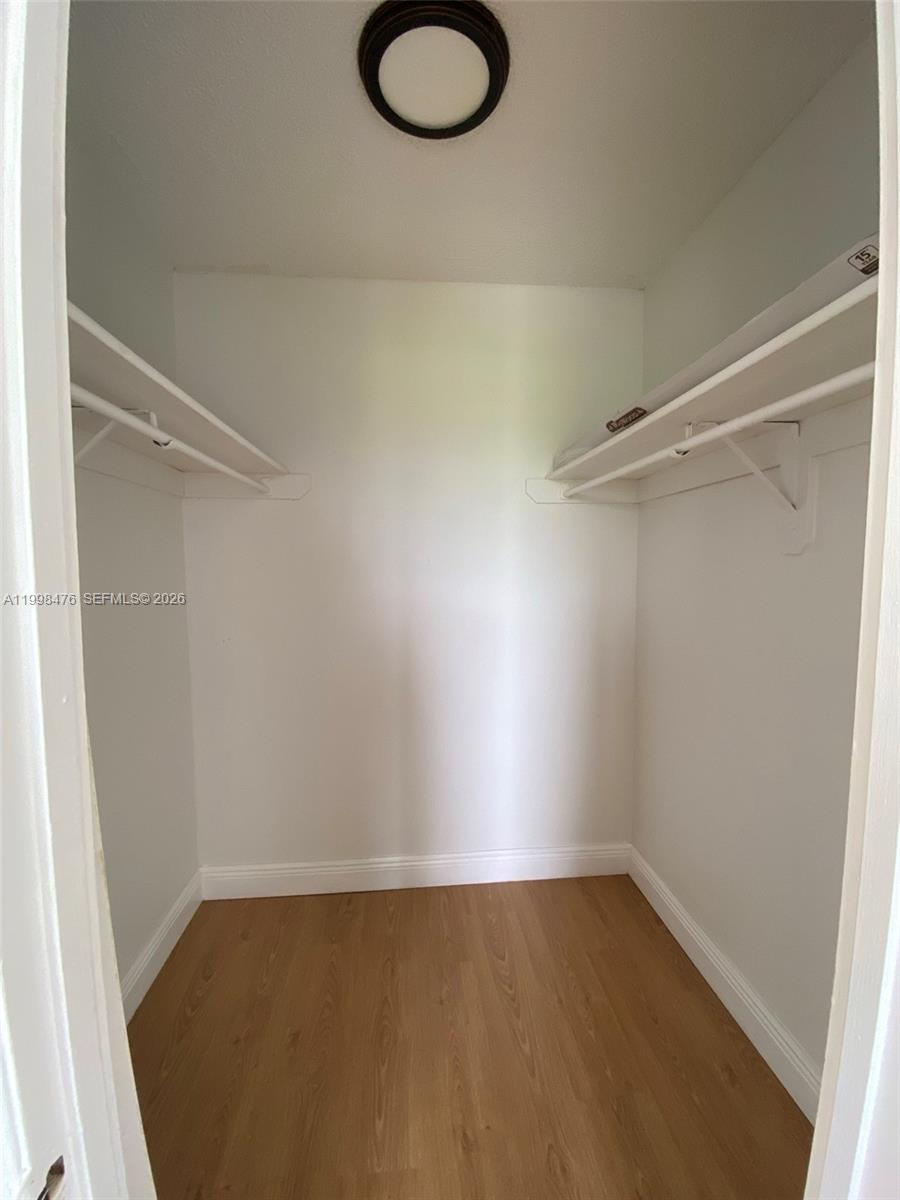 494 Northwest 165th Street, Unit C601 Miami, FL 33169 - Photo 22 of 22 a view of a room with racks on the wall