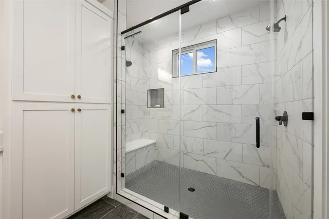 a bathroom with 2 sink and a mirror