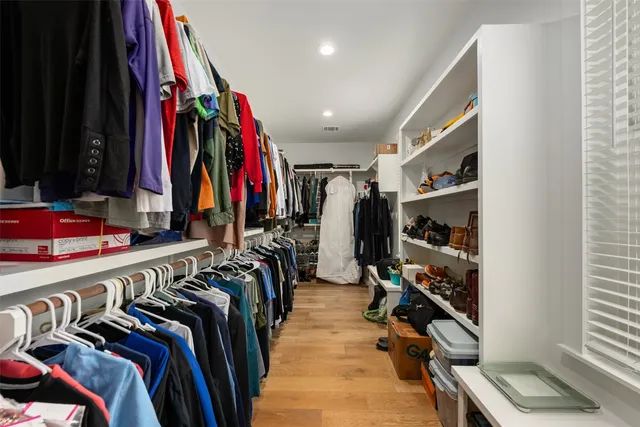 a bedroom with a bed window and a table