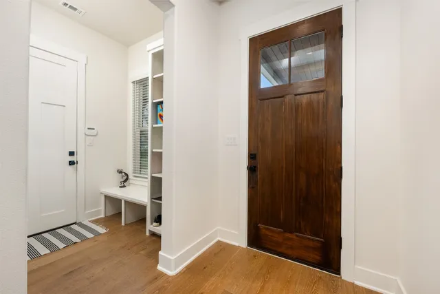 a view of workspace with furniture and wooden floor