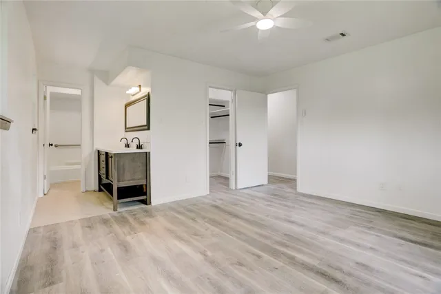 a view of empty room with a fireplace and cabinet