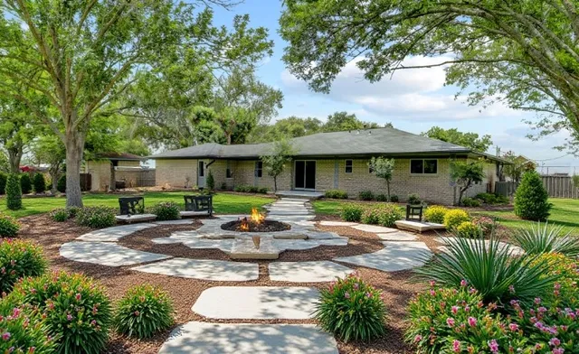 a front view of house with yard and green space