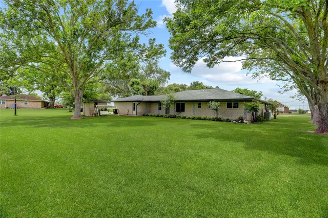 a view of a lake with a yard