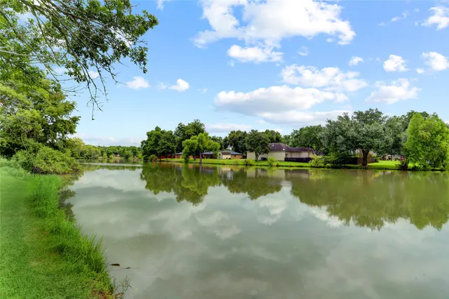 an aerial view of a house with a lake view