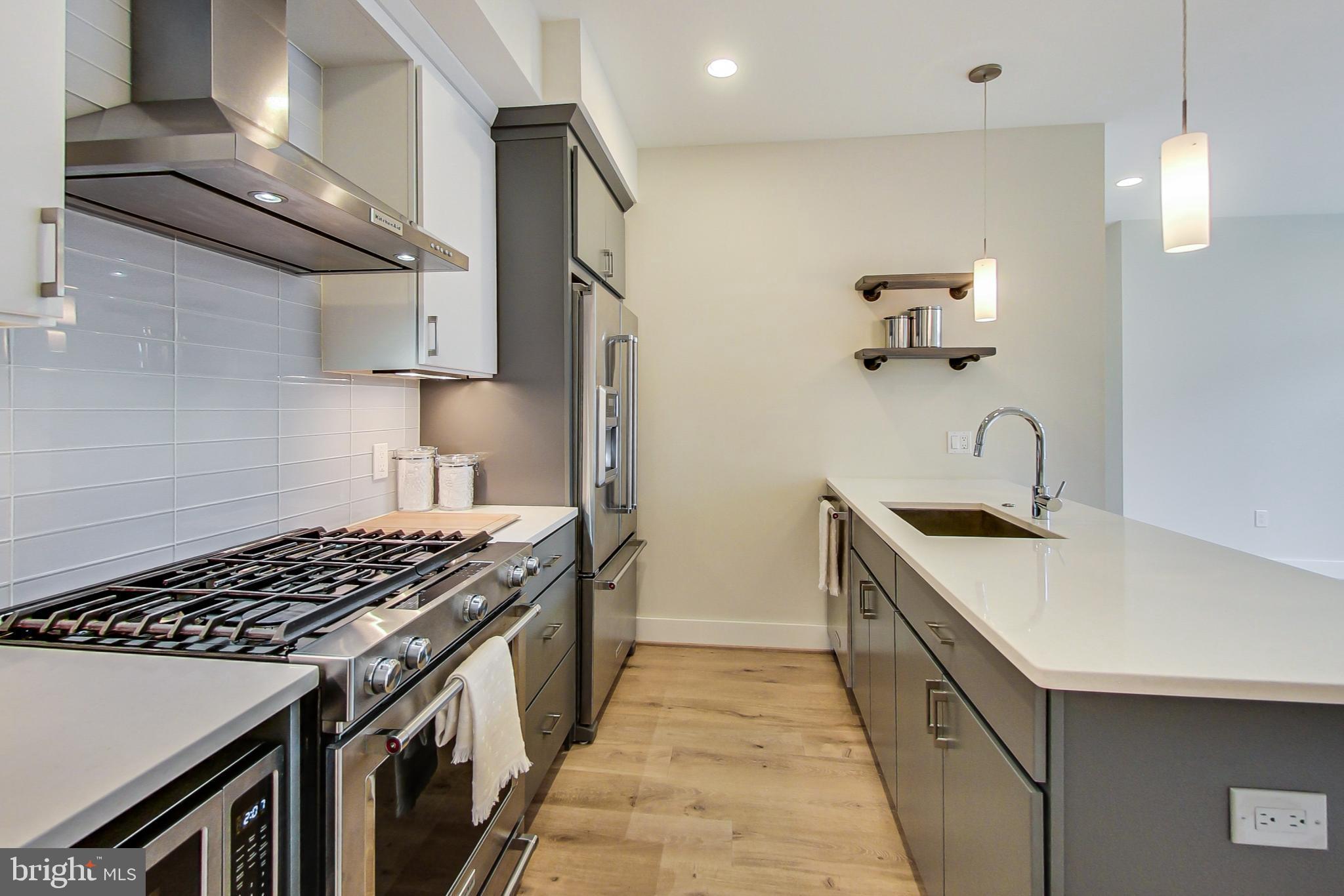 3035 15th Street Northwest, Unit 105 Washington, DC 20009 - Photo 13 of 50 Sleek modern kitchen with stylish finishes.