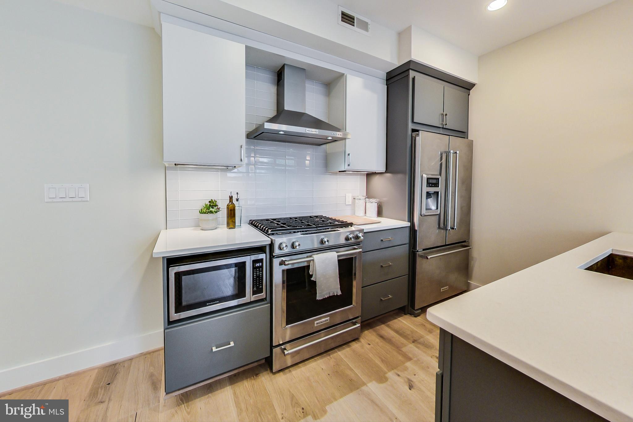 3035 15th Street Northwest, Unit 105 Washington, DC 20009 - Photo 14 of 50 Sleek modern kitchen with stylish finishes.