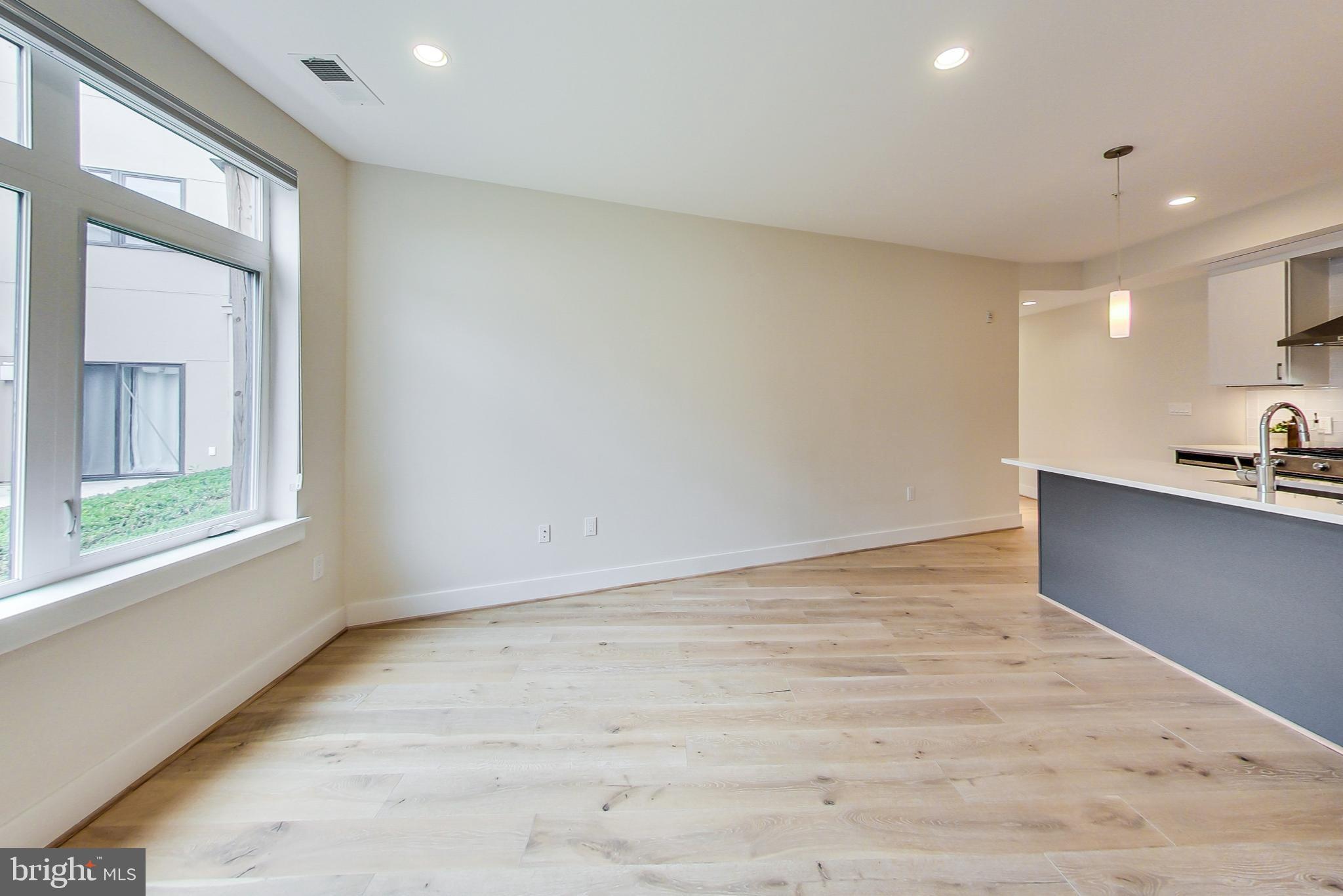 3035 15th Street Northwest, Unit 105 Washington, DC 20009 - Photo 19 of 50 Bright and airy open living space.