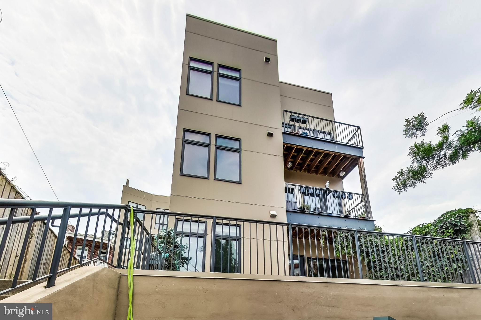 3035 15th Street Northwest, Unit 105 Washington, DC 20009 - Photo 31 of 50 Modern three-story residence with balconies.