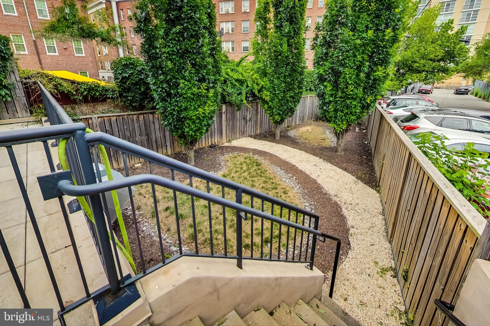 3035 15th Street Northwest, Unit 105 Washington, DC 20009 - Photo 32 of 50 Lush garden path invites serene strolls.