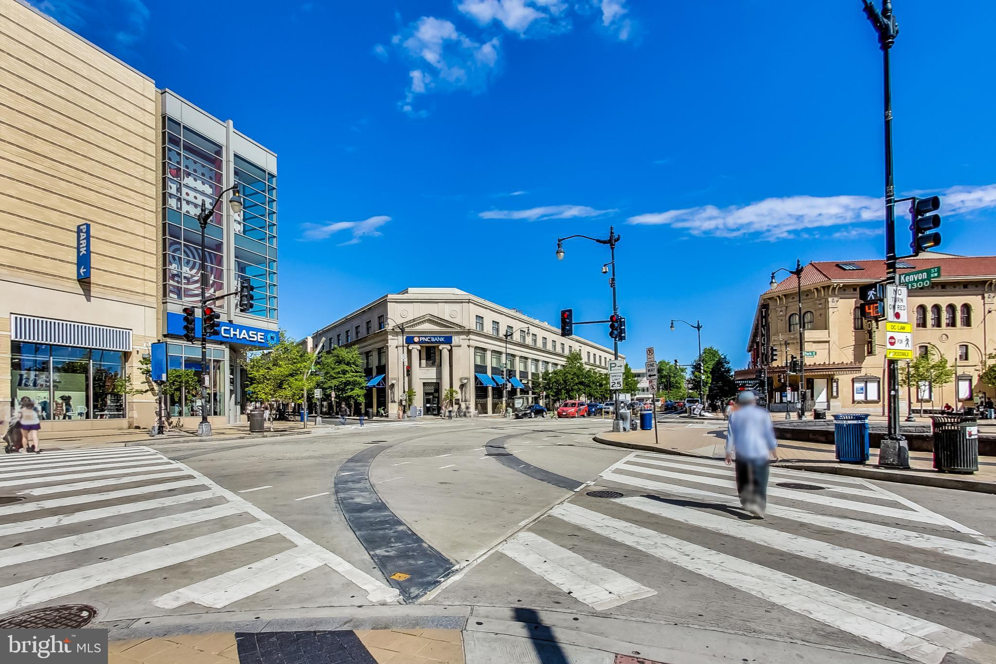 3035 15th Street Northwest, Unit 105 Washington, DC 20009 - Photo 48 of 50 Vibrant urban intersection under blue skies.