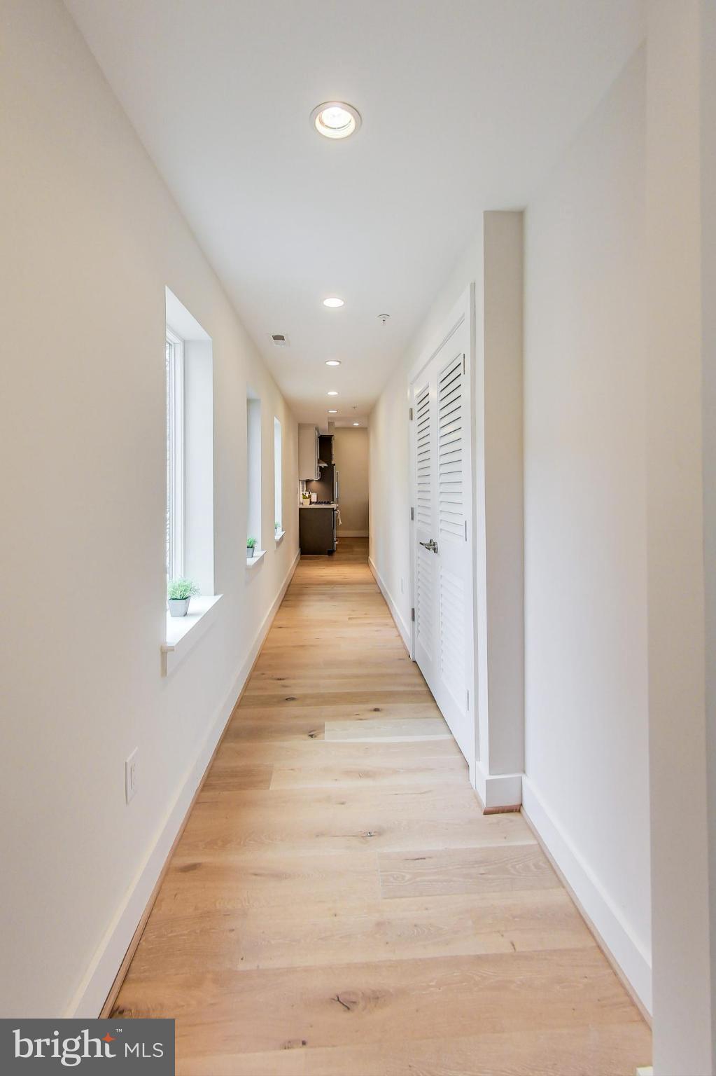 3035 15th Street Northwest, Unit 105 Washington, DC 20009 - Photo 10 of 50 Bright and inviting hallway with natural light.