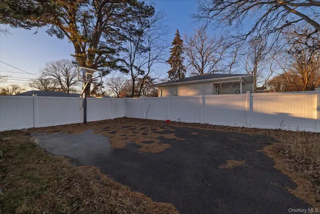 a view of a backyard with large trees