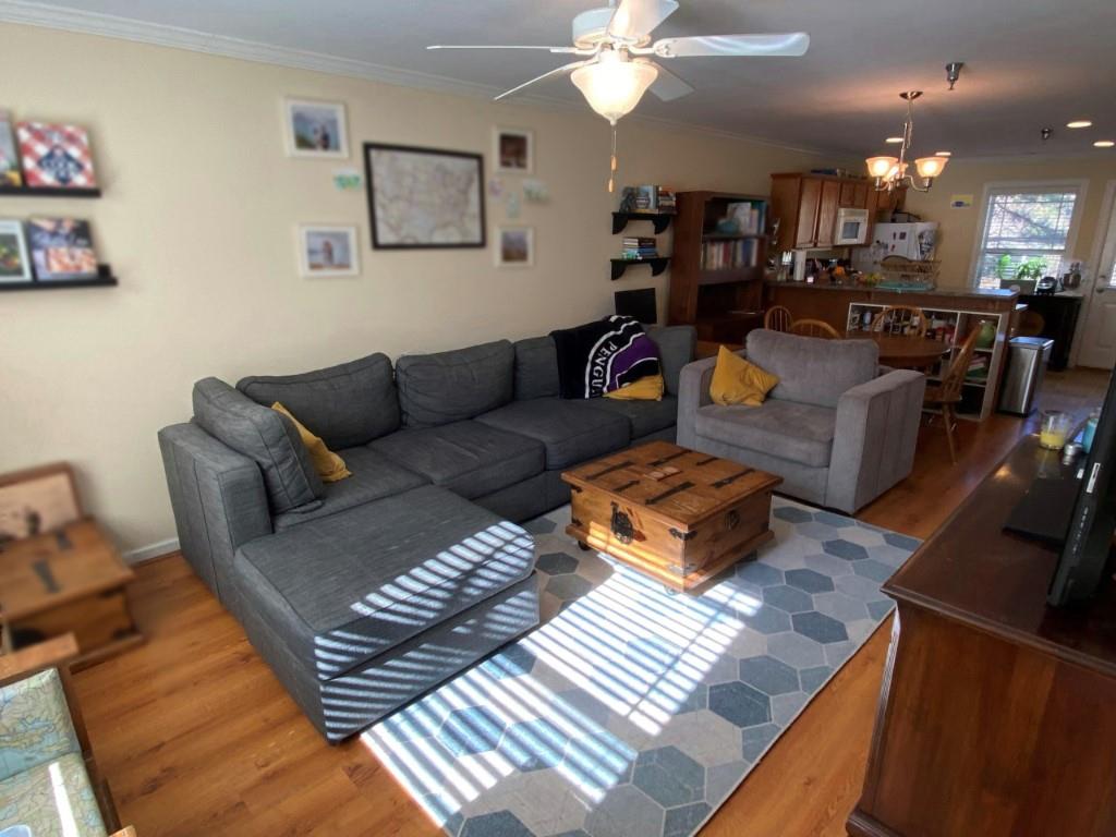 232 Epps Bridge Road, Unit 1A Athens, GA 30606 - Photo 3 of 14 a living room with furniture kitchen and a chandelier