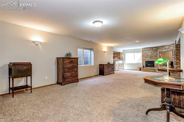 9737 Rockingham Drive Peyton, CO 80831 - Photo 17 of 28 ~Basement Family Room/Rec Room- so much space and so many possibilities!~