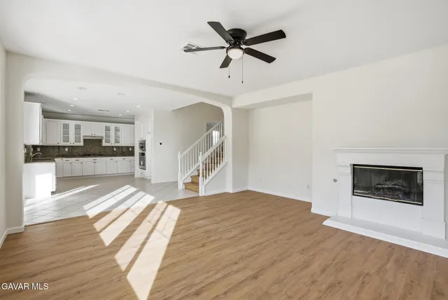 a view of hallway with wooden floor