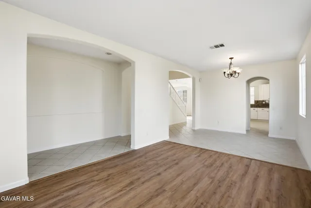 a view of an empty room and a window
