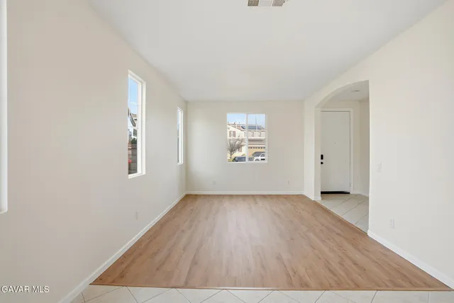 a view of a chandelier fan and entryway