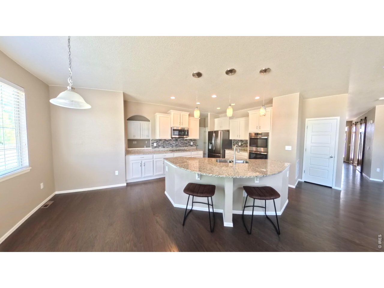 10434 Bluegrass Street Firestone, CO 80504 - Photo 5 of 26 Light and Bright open kitchen