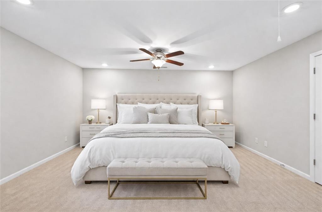 2405 Boxwalking Court Cumming, GA 30040 - Photo 23 of 54 a bedroom with a bed and a ceiling fan