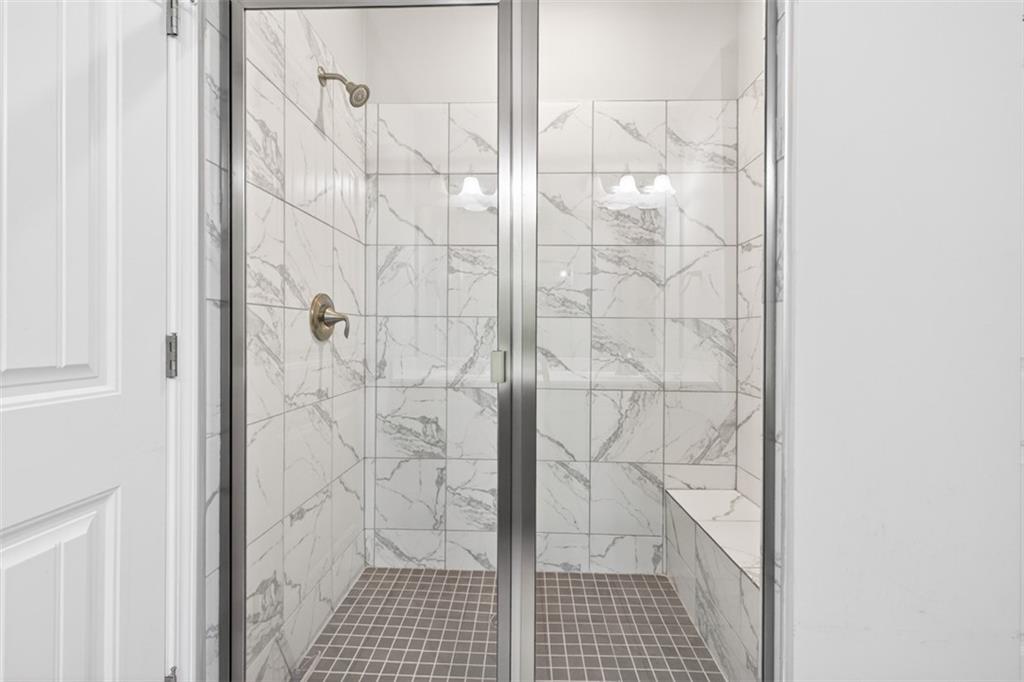 2405 Boxwalking Court Cumming, GA 30040 - Photo 26 of 54 a bathroom with a shower