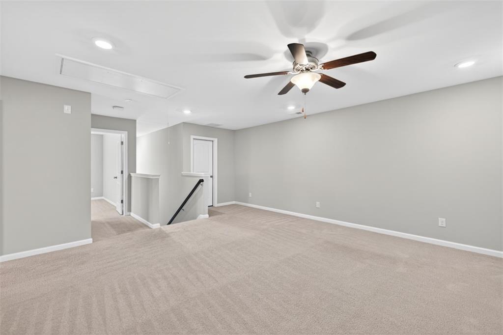 2405 Boxwalking Court Cumming, GA 30040 - Photo 30 of 54 a view of an empty room with a ceiling fan